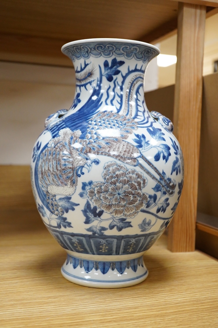 A Chinese underglaze blue and copper red baluster vase, 32cm high